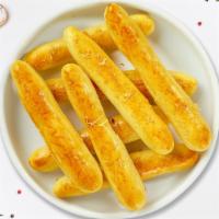 Cheese Breadsticks · Twelve sticks of crisp, baked cheese bread sticks from Italy. Served with ranch sauce.