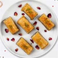 Baklava · (Two pieces) Phyllo dough and almonds or pistachio depending on availability.