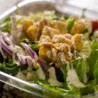 Caesar Salad · Romaine tossed with our special caesar dressing, finished with Parmesan and croutons.
