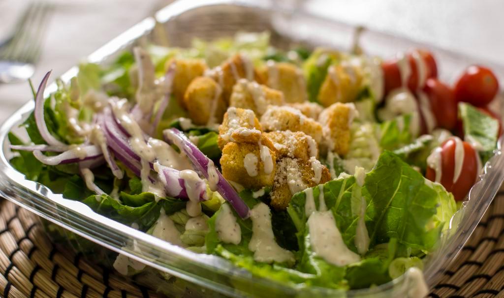 Caesar Salad · Romaine tossed with our special caesar dressing, finished with parmesan and croutons.