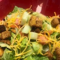 House Salad · Mixed greens, tomatoes, cucumbers, Cheddar cheese and croutons