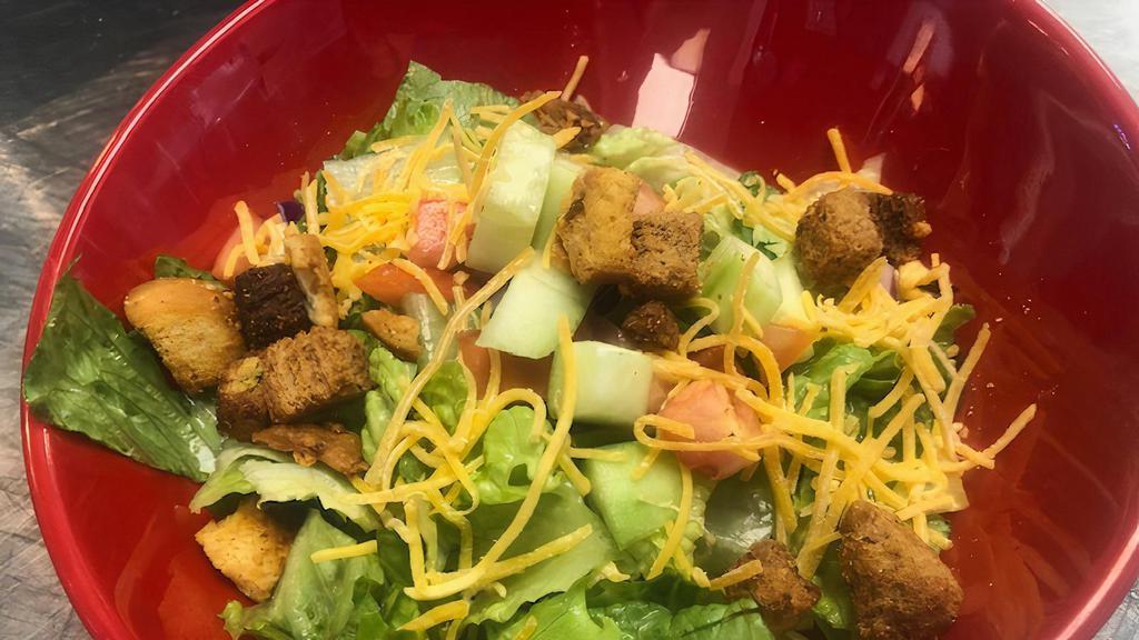 House Salad · Mixed greens, tomatoes, cucumbers, Cheddar cheese and croutons