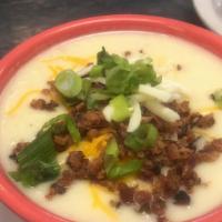 Baked Potato Soup · Creamy potato soup topped with cheddar cheese, bacon bits and green onions.