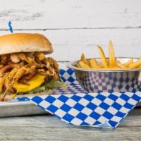 Backyard Barbecue Burger · Mesquite grilled beef patty on a toasted bun. Topped with American cheese, bacon, barbecue a...