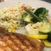 Grilled Salmon Platter · Mesquite-grilled and served with rice pilaf, vegetables, and sauce