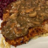 Jagerschnitzel · Thin pork, pretzel breaded and pan seared. Topped with mushroom, bacon, brown gravy. Served ...
