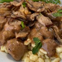 Beef Tips And Spatzel · Tender chunks of beef and gravy. Served over haus-made buttered spatzel. Served with rotkohl...