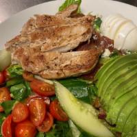 Cobb Salad · Bleu Cheese, Bacon, Hardboiled Egg, Avocado and Grape Tomatoes on a bed of Romaine lettuce. ...