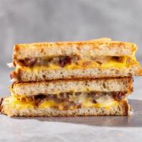 The Favorite · By Dallas Grilled Cheese Co.. Parmesan-crusted grilled sourdough with american, cheddar and ...