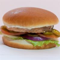 Yummy Salmon Burger · Yummy wild Alaskan salmon patty, lettuce, tomato, onion jalapeño, and white yogurt sauce.