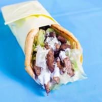 Gyro On A Naan · Our special Gyro cooked on a flat Grill served with Naan, Lettuce ,Red Onion  and White sauce.