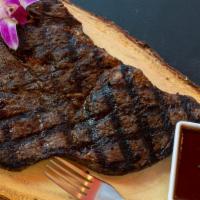 T-Bone Steak · Our one pound Black angus T -Bone Steak served with, Side salad  or Yummy Rice or French fri...