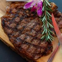 Rib Eye Steak With Bone · Rib Eye Steak with Bone comes with Side salad or Rice or French Fry.