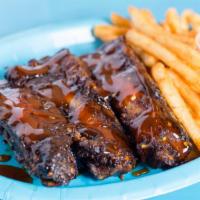 Yummy Beef Ribs · Slow cooked baby beef ribs with French fries and Yummy BBQ sauce.
