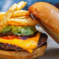 Big Tex · Cheddar, house-made guacamole, fried onion strings, chipotle sauce