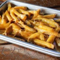 Org Twisted Cheese Fries · Our hand-punched fries with lots of melted cheddar cheese