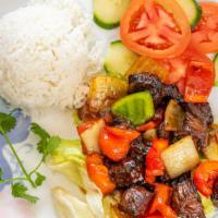 Shaking Beef · Served with tomatoes, cucumber, side of house salad and steam rice