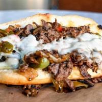 Works · Choice of ribeye or chicken, caramelized onion, bell pepper, mushroom, jalapeno, provolone c...