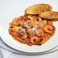 Cajun Pasta · Shrimp, chicken, and sausage served with linguine pasta and our homemade cajun sauce.