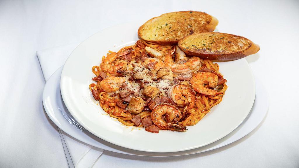 Cajun Pasta · Shrimp, chicken, and sausage served with linguine pasta and our homemade cajun sauce.