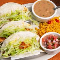 Shrimp · Three shrimp soft tacos with lettuce. Served with rice, beans, and pico.