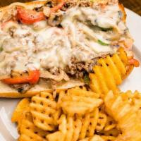 Steak & Cheese Sandwich · Shaved ribeye with green peppers, onions, and mushrooms, topped with jack cheese