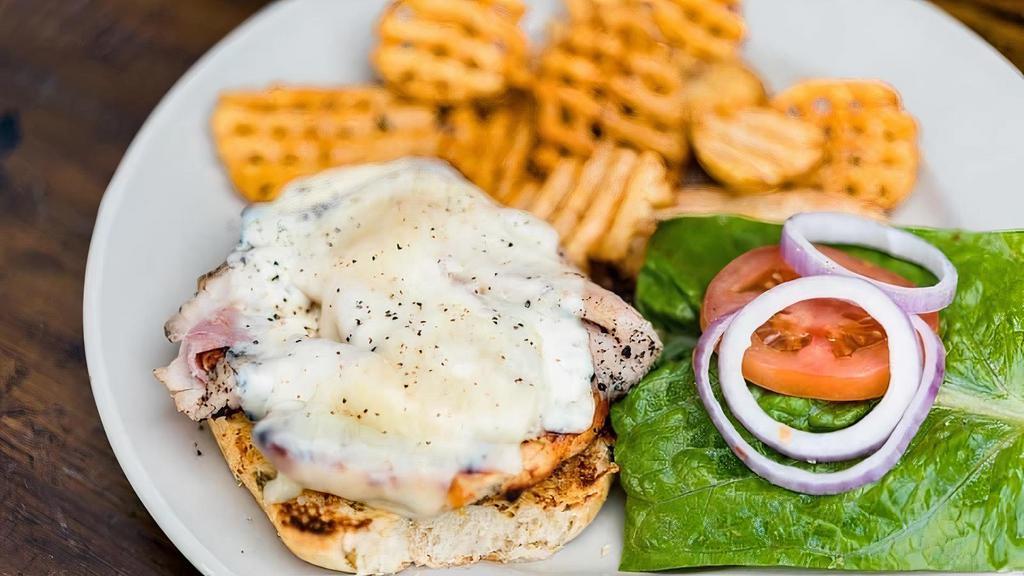 The “Sammich” · Grilled chicken topped with smoked ham and cheese.