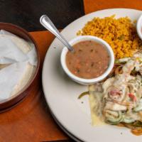 Santiago Chicken Fajitas · Onions and peppers topped with jack cheese. Served with rice, beans, and flour tortillas.