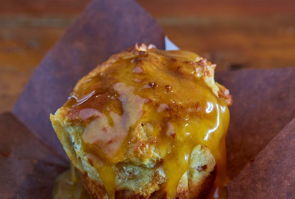 Bread Pudding · Made from the dugg-out parts of the bun and topped with our warm caramel sauce.