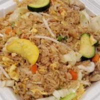 Vegetable Fried Rice · White rice stir-fried in soy sauce with eggs, green peas, carrots, bean sprouts, cabbage, zu...