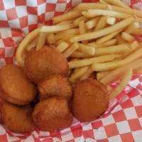 Kids' Chicken Nuggets · Breaded chicken nuggets served with french fries.