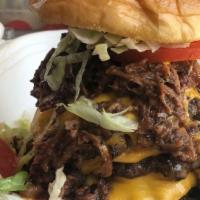 $20 Burger · Three 1/3 lb. patty's with cheese topped with Chopped Brisket and served with lettuce, tomat...