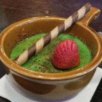Pandan Creme Brulee · Rich aroma of pandan, finish of a deftly burnt sugar topping, garnished with egg roll biscuit.