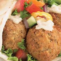Falafel Pita · Veggie falafel wrap. comes with lettuce, tomatoes, onions, and our special delicious white s...