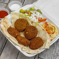 Falafel Plate · 5 pieces of falafel topped with tahini sauce and served with salad and pita bread.