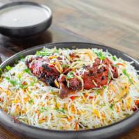 Chicken Tandoori Biryani · Tandoori biryani is a rice dish prepared by roasting chicken marinated in yogurt and spices ...