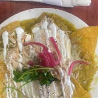 Chilaquiles · Tortilla Chips,  Green Salsa, Cotija Cheese and Eggs Cooked to Order