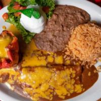 San Luis Dinner · One cheese enchilada, one bell pepper with ground beef or shredded chicken, served with rice...