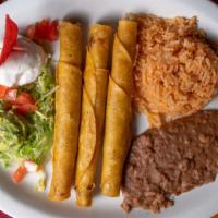 Chicken Flautas · Three corn tortillas stuffed with shredded chicken. Served with sour cream, guacamole, rice,...