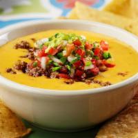 Rick'S Special · Queso topped with seasoned beef,  guacamole, and pico de gallo. Served with tortilla chips