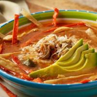 Tortilla Soup · A delicious combination of chicken in a light spicy broth, topped with crispy tortilla strip...
