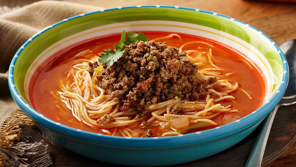 Sopa De Fideo · A delicious combination of Vercelli pasta, a savory tomato broth with seasoned beef and just the right amount of spice