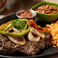 Steak Ranchero · A marinated Angus Beef Fajita Steak topped with sauteed bell peppers and onions. Served with...