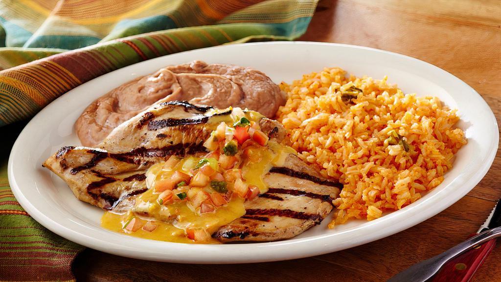 Mirasol Especial · Seasoned grilled chicken breast covered with queso, and topped with pico de gallo. Served with rice, beans