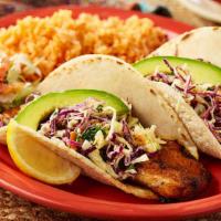 Fish Or Shrimp Tacos · Your choice of grilled fish or shrimp in our homemade corn tortilla, topped with cilantro, c...