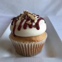 Almond Raspberry Cream Cupcake · One of our most popular cupcakes. Almond cake with raspberry filling and cream cheese icing.