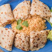 Quesadillas · Homemade tortillas stuffed with choice of grilled chicken or beef fajita, and jack cheese. S...