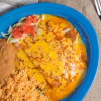 Cheese Enchiladas · Two cheese enchiladas smothered with our traditional chili gravy and topped with melted chee...