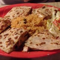Veggie Quesadillas · Grilled mushrooms, bell pepper, onions, and jack cheese; served with sour cream and guacamol...