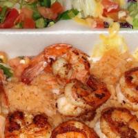 Shrimp & Veggies · Ten shrimp served on a sizzling plate with vegetables, rice and beans.